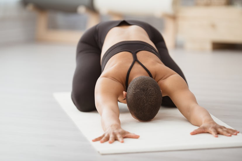 Sink into child's pose for full-body relaxation after a ride.