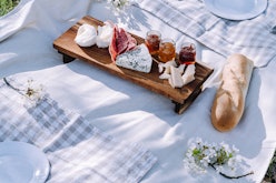 A cheese board and linens help create an Instagram-worthy picnic.