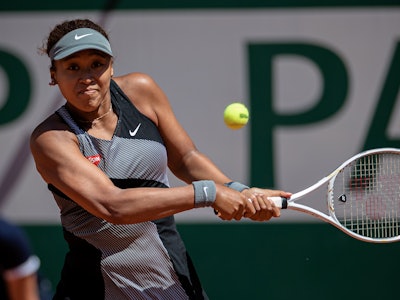 Osaka Naomi of Japan returns the ball during the women's singles first round match against Patricia ...