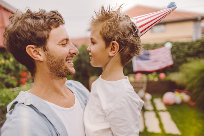 Photo of father and son celebrating Fourth of July in their yard, fourth of july puns