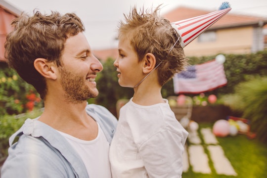 Photo of father and son celebrating Fourth of July in their yard, fourth of july puns