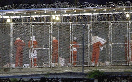 (FILES) This file photo shows detainees as they prepare themselves for the evening prayer 04 March 2...
