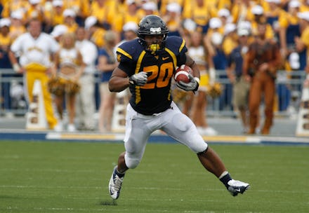 MORGANTOWN, WV - SEPTEMBER 01:  Shawne Alston #20 of the West Virginia Mountaineers carries the ball...