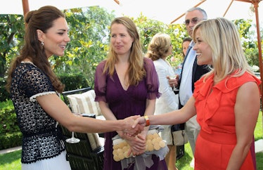 Catherine, Duchess of Cambridge meets actress Reese Witherspoon as she attends a reception to mark t...