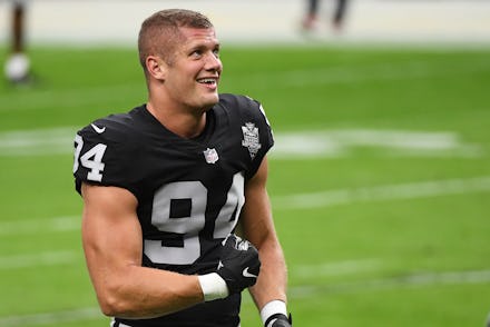LAS VEGAS, NEVADA - NOVEMBER 15: Carl Nassib #94 of the Las Vegas Raiders flexes while smiling durin...