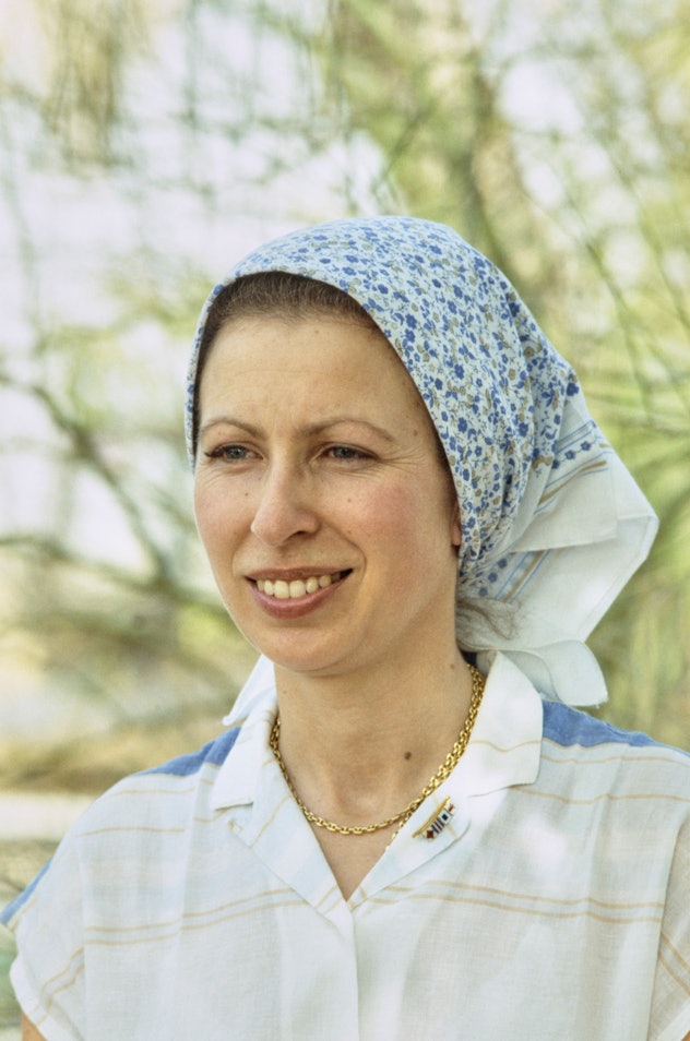British Royal Princess Anne, Princess Royal wearing a blue floral print headscarf, during a visit to...