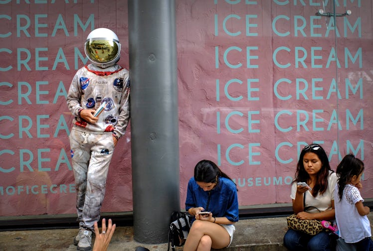 NEW YORK, NY - JULY 29: A man dress up as astronaut stands outside the new Museum of Ice Cream acros...