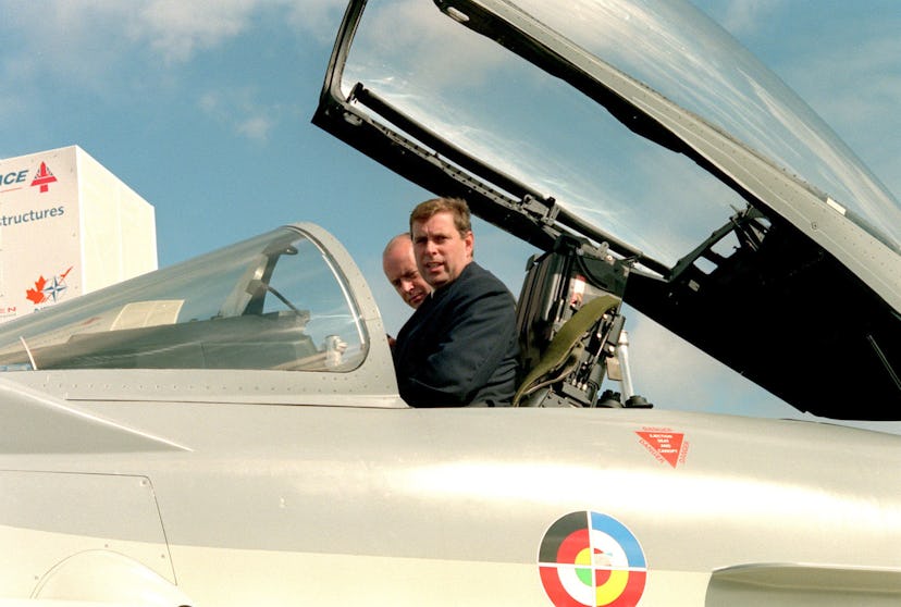 PA NEWS PHOTO 8/9/98 Prince Andrew, the Duke of York, right, sits at the controls of the new Typhoon...