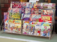 "Spokane, Washington, USA - August 25, 2012: Assortment of popular comic books for sale outside of a...