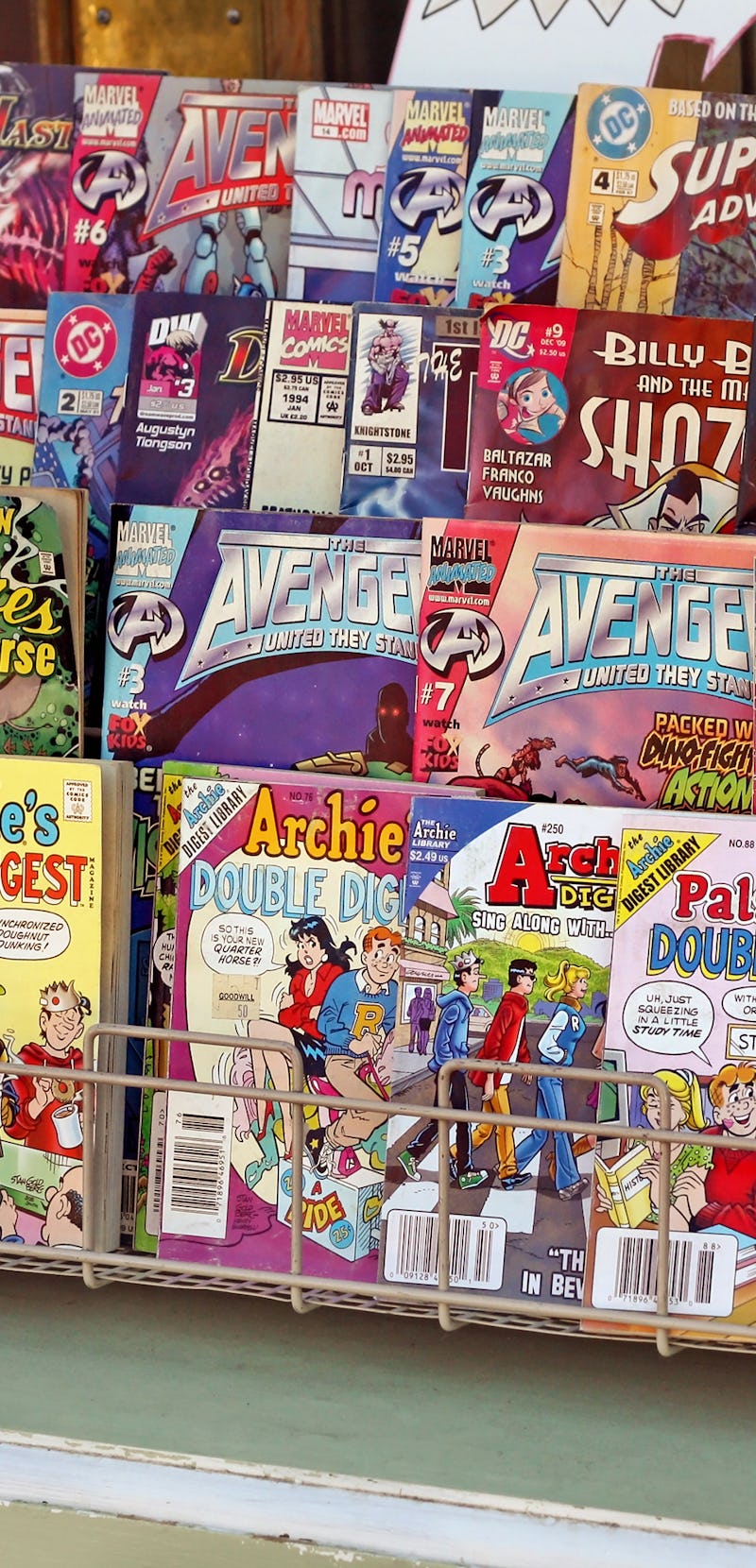 "Spokane, Washington, USA - August 25, 2012: Assortment of popular comic books for sale outside of a...