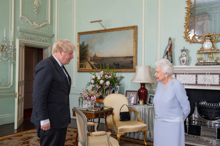 Britain's Queen Elizabeth II greets Britain's Prime Minister Boris Johnson during an audience at Buc...