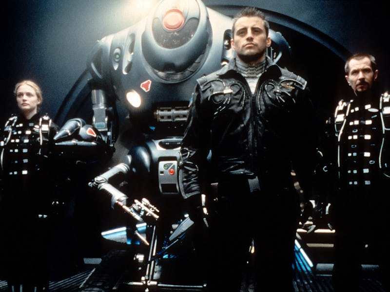 Gary Oldman, William Hurt, Heather Graham and Matt LeBlanc standing with a space machine in a scene ...