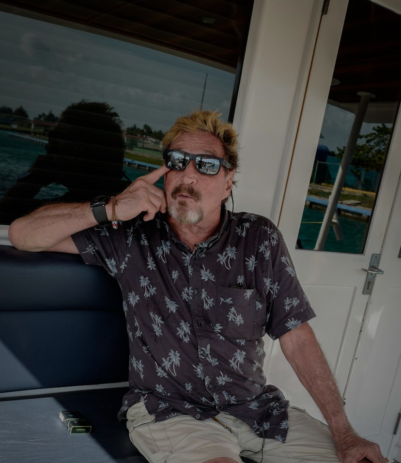 US millionaire John McAfee gestures during an interview with AFP on his yacht anchored at the Marina...