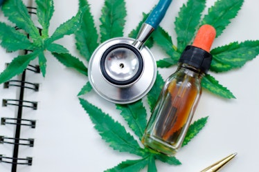 CBD or THC oil medical treatment in doctor laboratory. alternative medicine and cannabis concept.
