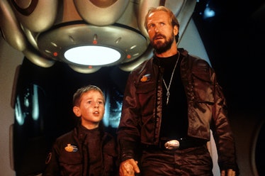 William Hurt standing next to a child in a scene from the film 'Lost In Space', 1998. (Photo by New ...