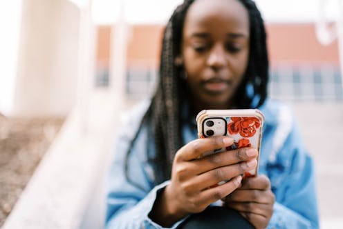 A woman stares at her phone as a number similar to hers calls her. Here's the deal if you keep getti...