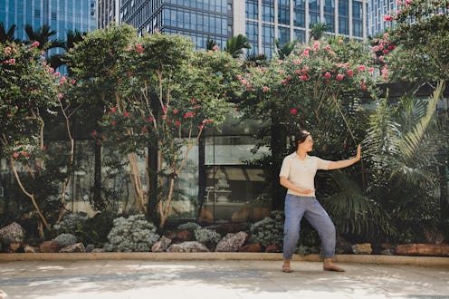 A person closes their eyes while practicing Tai Chi. Tai Chi can help alleviate stress, anxiety, and...