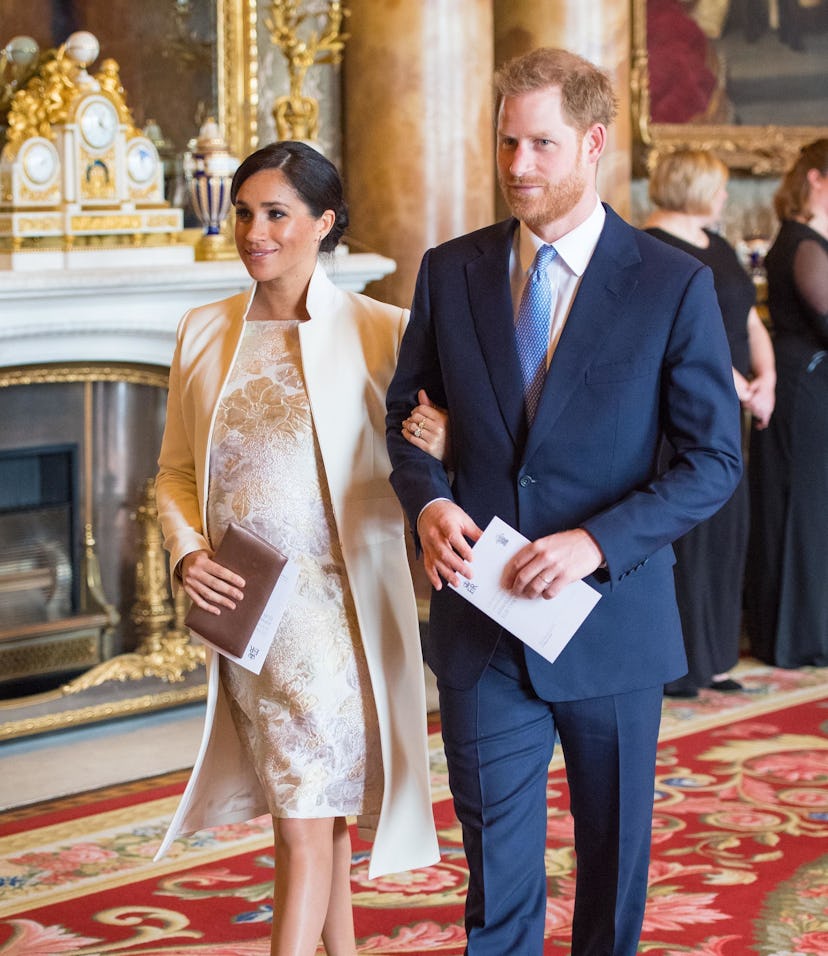 Britain's Prince Harry, Duke of Sussex, (R) and Britain's Meghan, Duchess of Sussex (L) attend a rec...