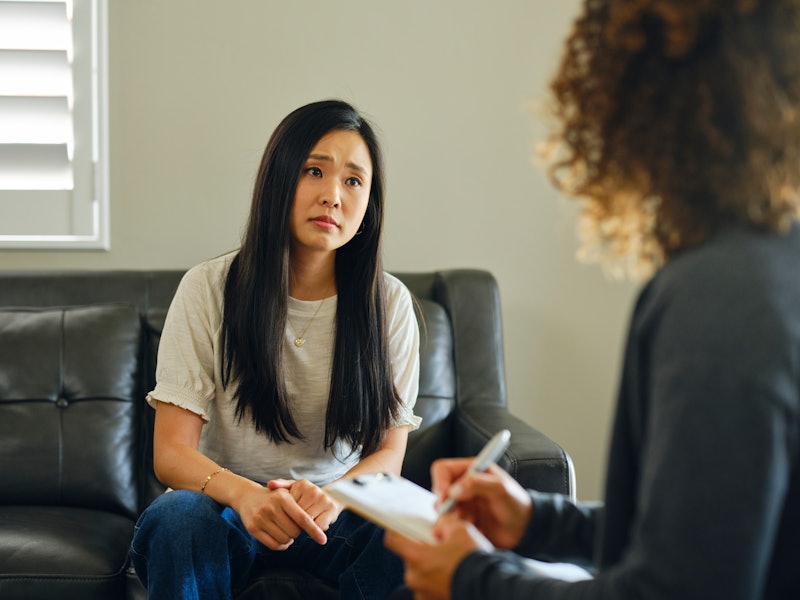 A young adult in a counseling session with a counselor.