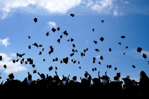 BRADFORD, ENGLAND - JUNE 11: Year 11 students of the BBG Academy celebrate their graduation by throw...