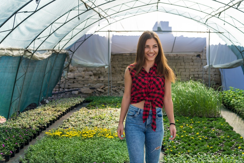 Young flower growers in the family greenhouse