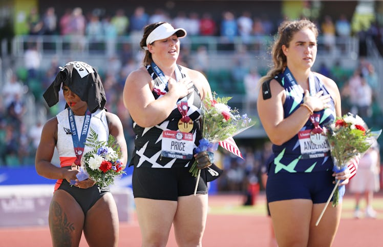 Gwen Berry (left), third place, looks on during the playing of the national anthem with DeAnna Price...