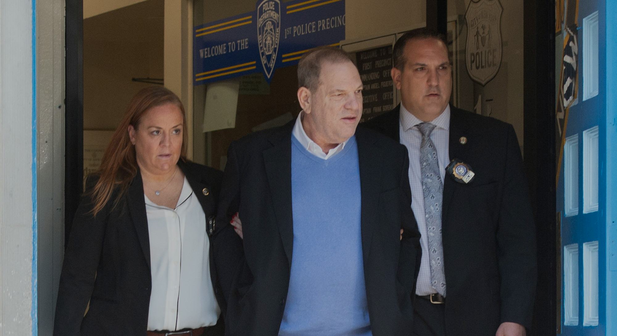 TOPSHOT - Harvey Weinstein (C) leaves the New York City Police Department's First Precinct on May 25...