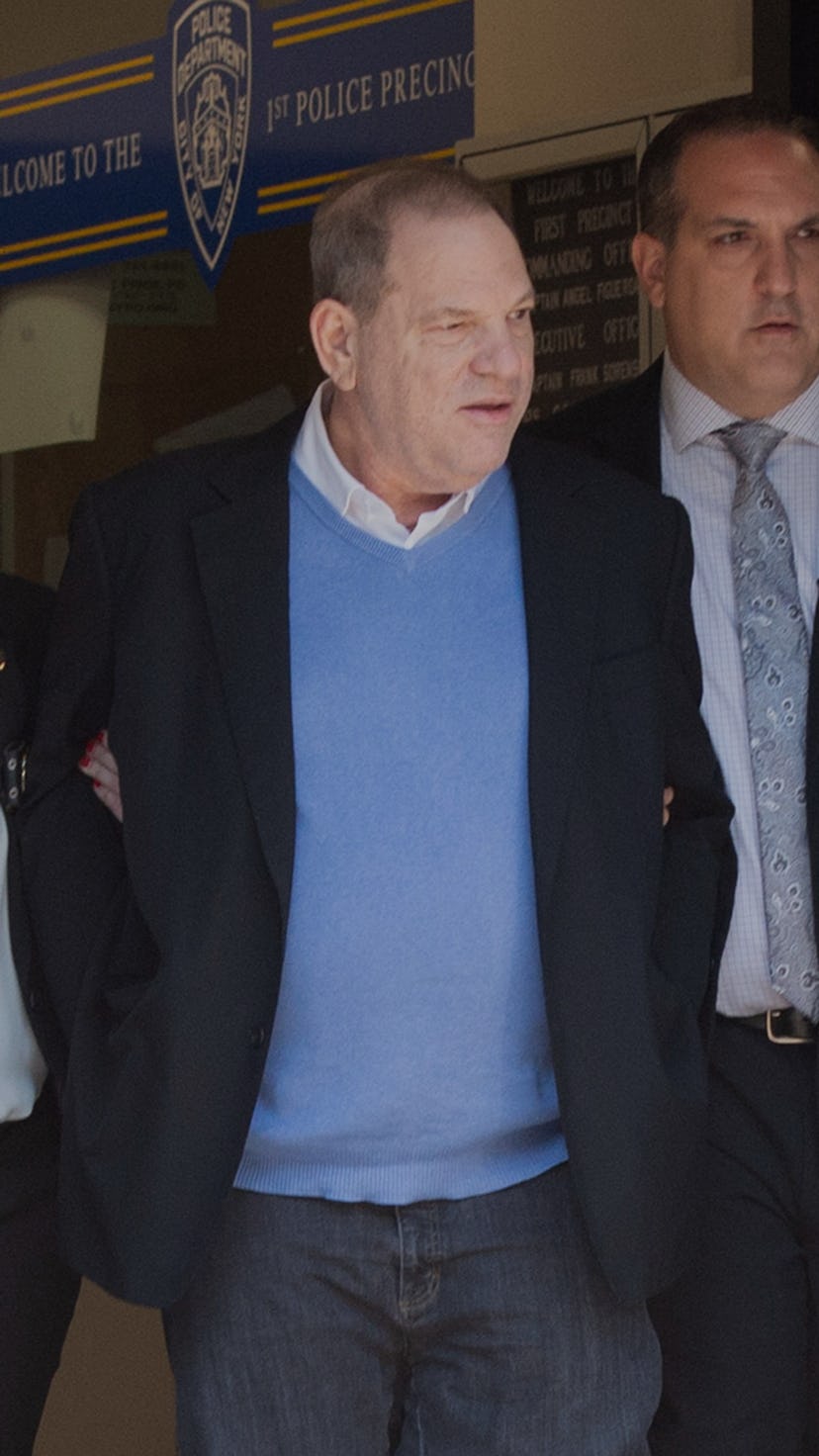 TOPSHOT - Harvey Weinstein (C) leaves the New York City Police Department's First Precinct on May 25...