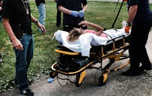 WARREN, OH - JULY 14: Medical workers and police treat a woman who has overdosed on heroin, the seco...