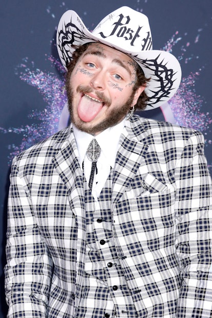 Celebrity Cancer Post Malone shows some personality while sticking his tongue out on red carpet.