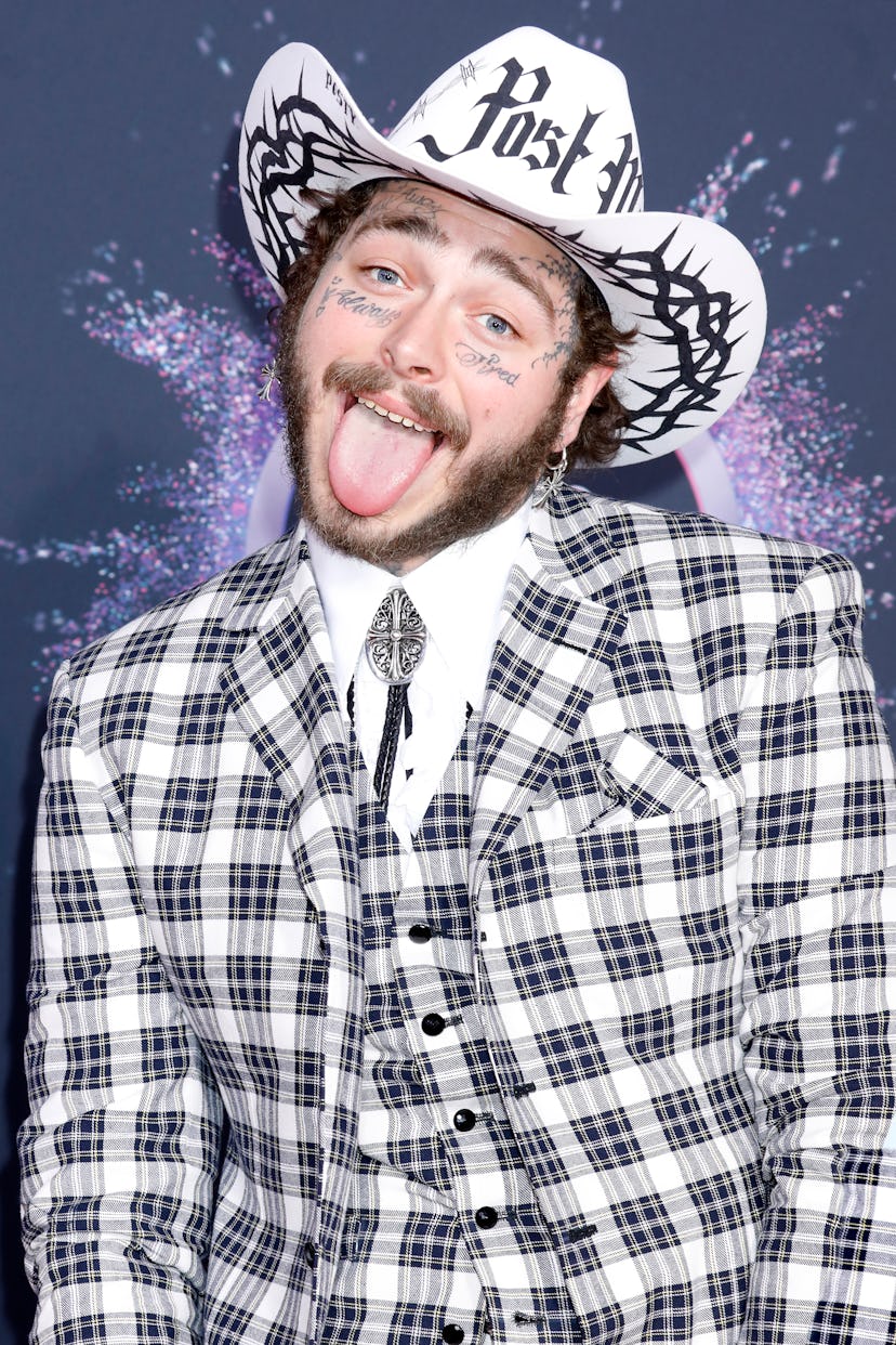 Celebrity Cancer Post Malone shows some personality while sticking his tongue out on red carpet.