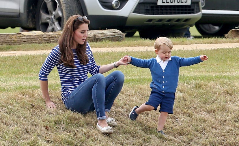 Prince George helps his mom.