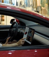HUAI'AN, CHINA - JUNE 13, 2021 - Residents view a new energy Tesla car at a shopping mall in Huai 'a...