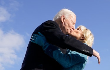 TOPSHOT - US President Joe Biden (L) kisses his wife US First Lady Jill Biden after being sworn in d...