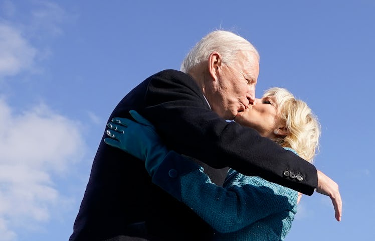 TOPSHOT - US President Joe Biden (L) kisses his wife US First Lady Jill Biden after being sworn in d...
