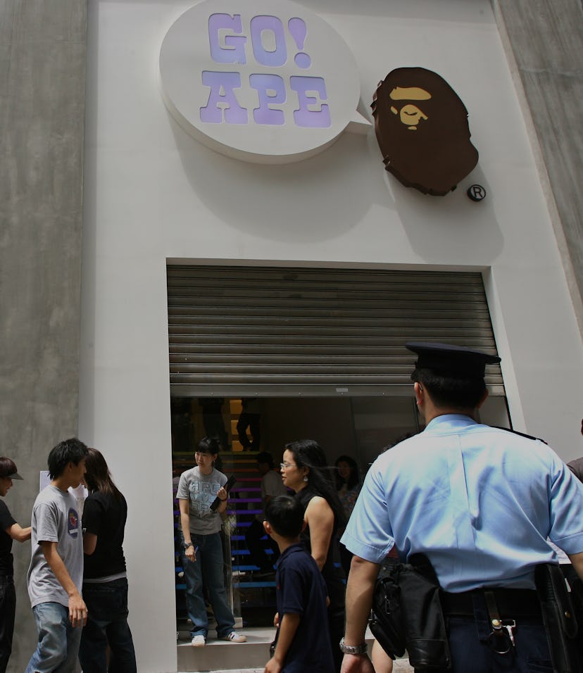 More than a hundred of young people queue in the hope of securing a limited-edition $599 camel-flap ...