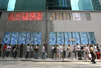 More than a hundred of young people queue in the hope of securing a limited-edition $599 camel-flap ...