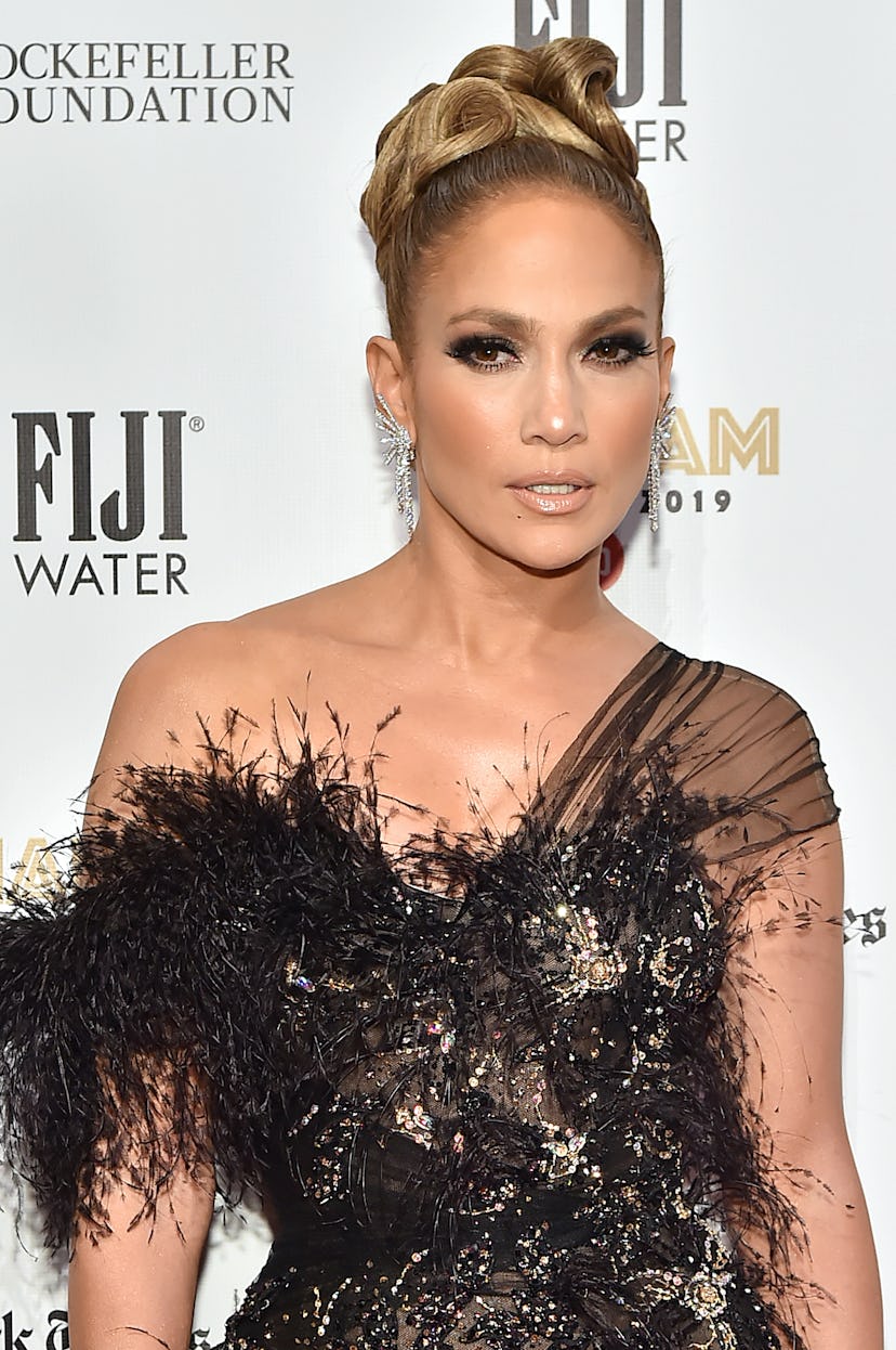 Jennifer Lopez shows off her Leo energy while walking the red carpet. 