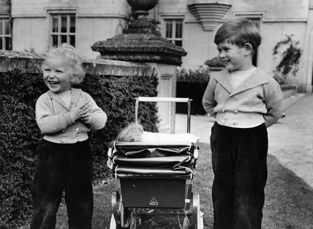 Princess Anne (left) and Prince Charles laughing together as children.
