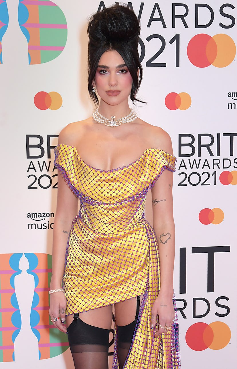 Celebrity Leo Dua Lipa embodies her star sign energy as she arrives at The BRIT Awards.