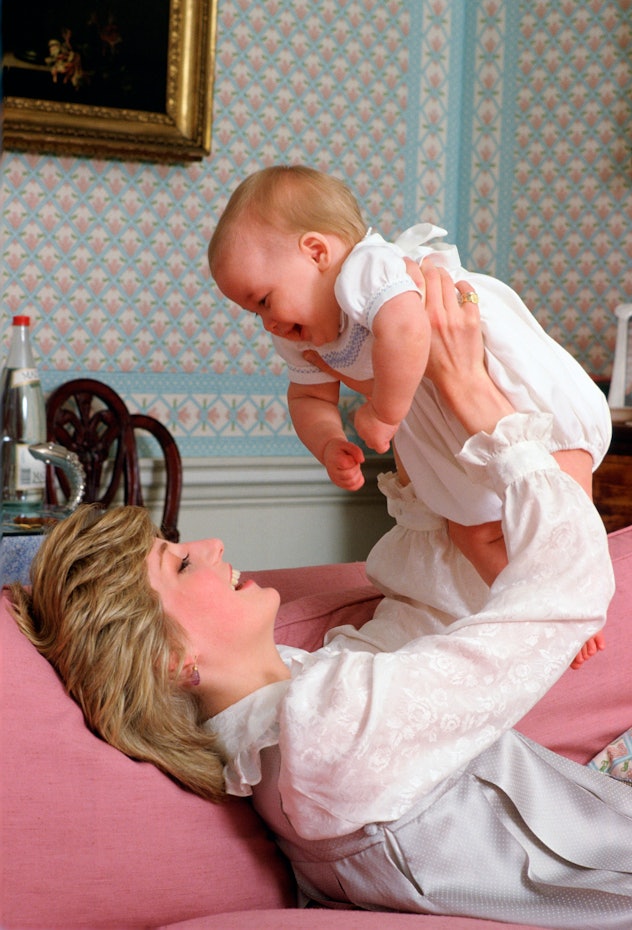 Princess Diana holds her baby son Prince William.