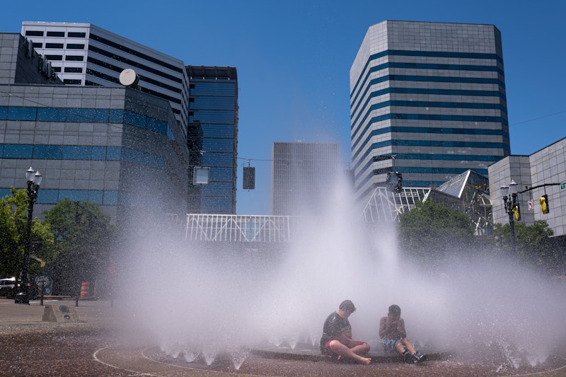 People play in a fountain to cool down during the Pacific Northwest Heat wave. Here's how to help pe...