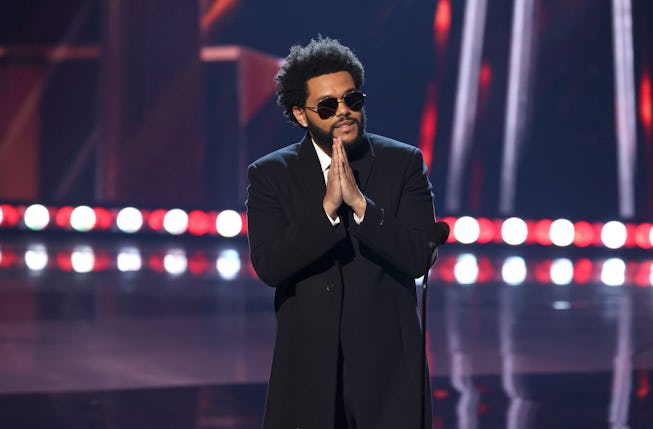 LOS ANGELES, CALIFORNIA - MAY 27: (EDITORIAL USE ONLY) The Weeknd accepts the Song of the Year award for 'Blinding Lights' onstage at the 2021 iHeartRadio Music Awards at The Dolby Theatre in Los Angeles, California, which was broadcast live on FOX on May 27, 2021. (Photo by Kevin Winter/Getty Images for iHeartMedia)