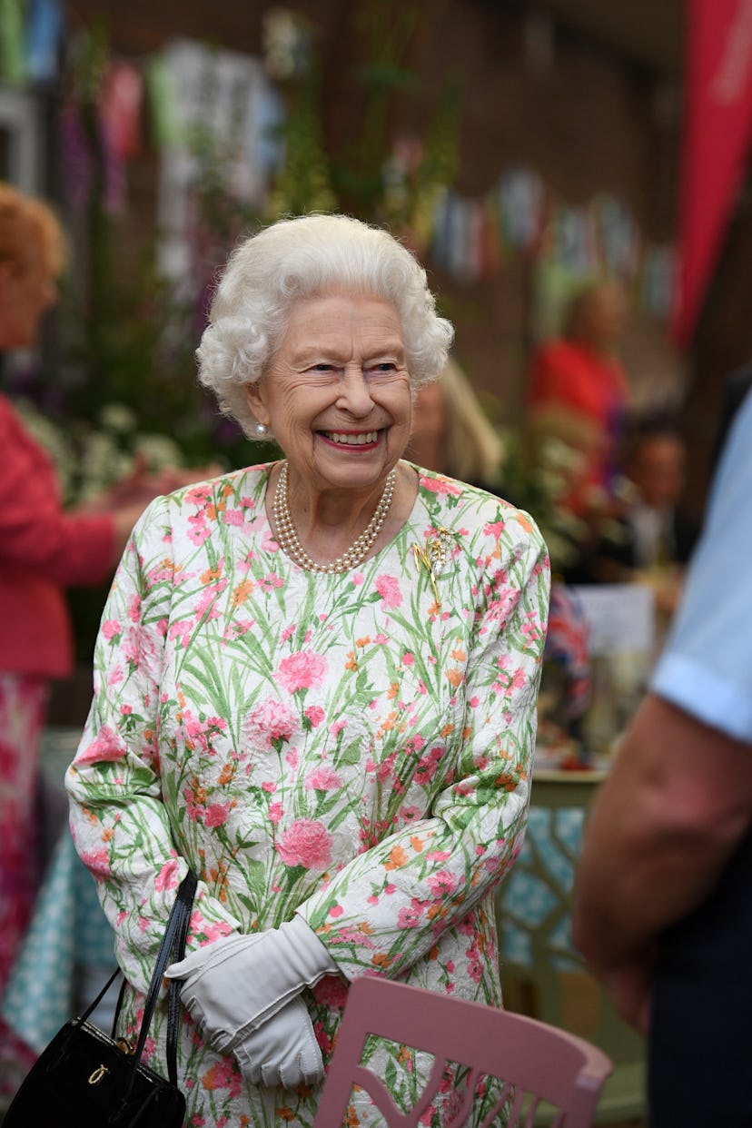 ST AUSTELL, ENGLAND - JUNE 11: Queen Elizabeth II smiles as she meets people from communities across...