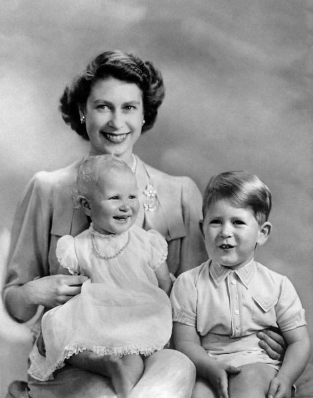 Princess Elizabeth poses with her two children Princess Anne and Prince Charles on 1951. (Photo by -...