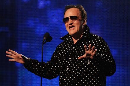 Film director Quentin Tarantino introduces Drake, Eminem and Lil Wayne during the Grammy Show at the...
