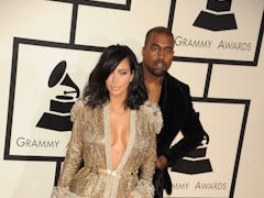 Rapper Kanye West and TV personality Kim Kardashian arrive at The 57th Annual GRAMMY Awards held at ...