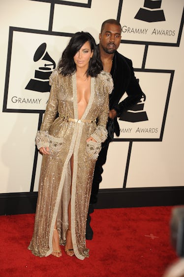 Rapper Kanye West and TV personality Kim Kardashian arrive at The 57th Annual GRAMMY Awards held at ...