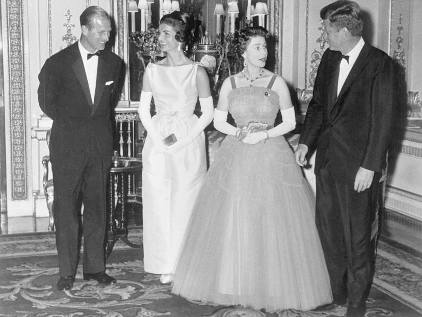 Queen Elizabeth greets President John F. Kennedy.