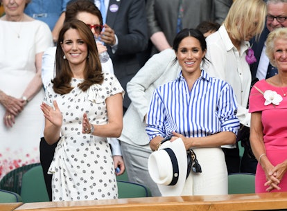 Kate Middleton and Meghan Markle attend a tennis match at Wimbledon.